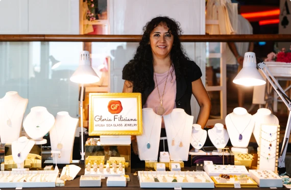 Vendor at a jewelry display at an event