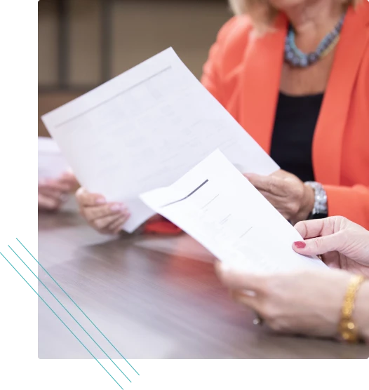 Two people reviewing a printed document