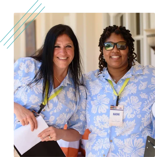 Two M&IW event staff in matching shirts at an event