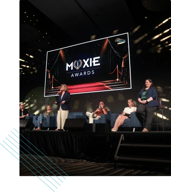 Awards ceremony stage with a panel of speakers