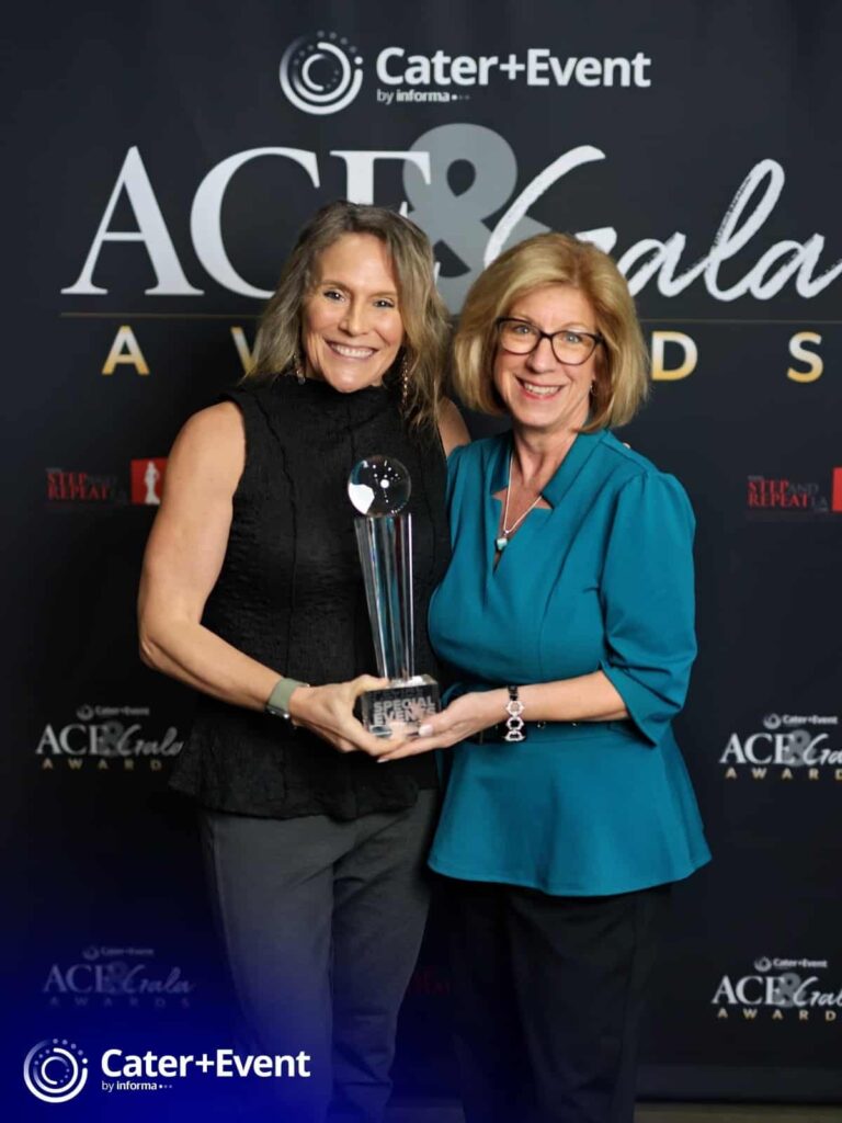 M&IW's Kelly Peiffer, left, and Tracy Norum pose with M&IW's 2026 Gala Award trophy