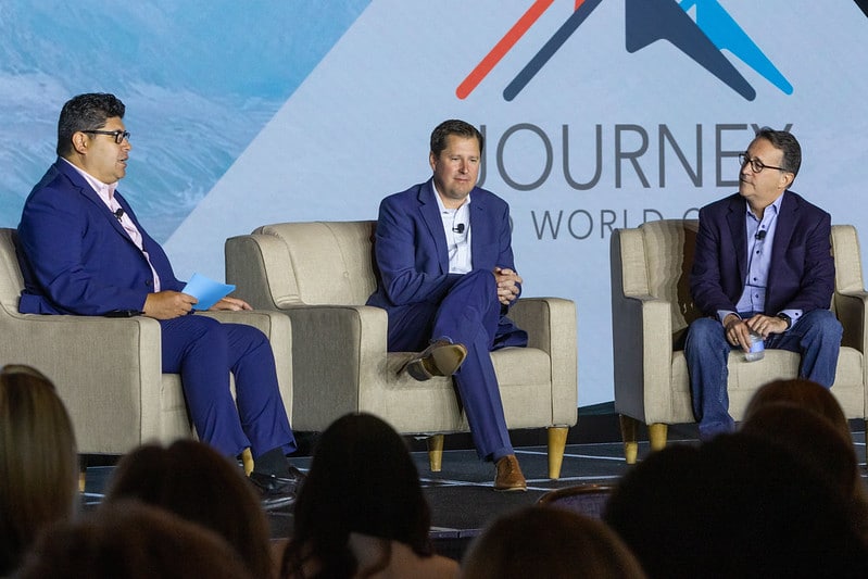 Michael Garcia, Kraig Stabenow, and Ron Needham speaking at the 2022 M&IW Summit