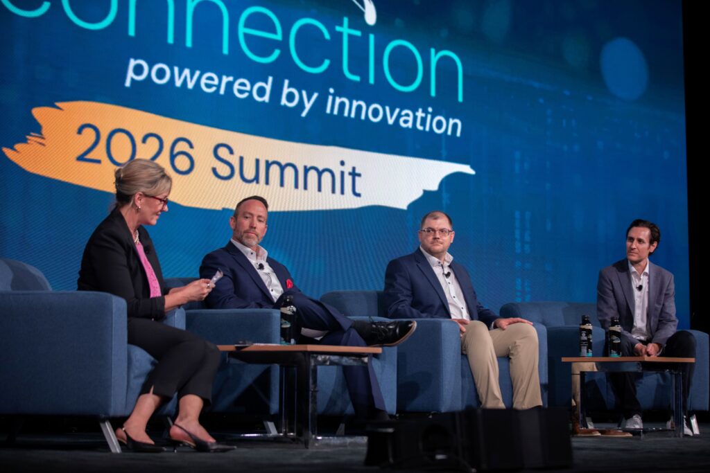 Panelists onstage at the 2026 M&IW Summit