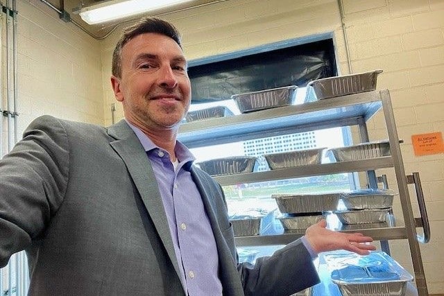 M&IW's Marcelo Casadei Shows off some of the meals donated after the 2025 M&IW Summit