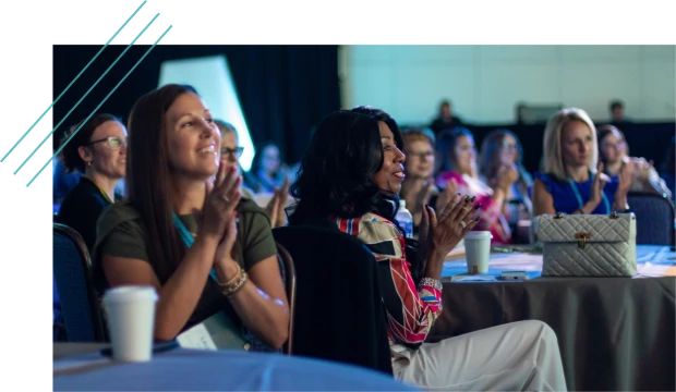 Audience clapping at a corporate conference