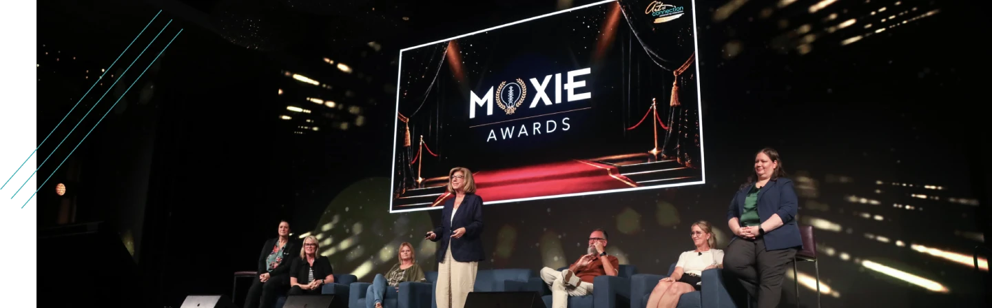 Panel discussion on stage at a recognition event