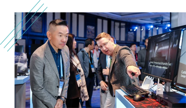 Attendees viewing a technology demo at a trade show booth
