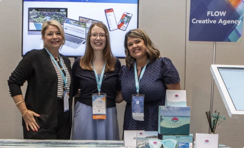 Flow team members at an event booth