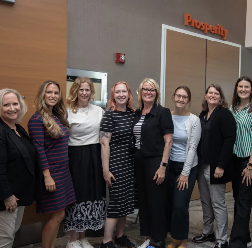 M&IW team members posing together at an event