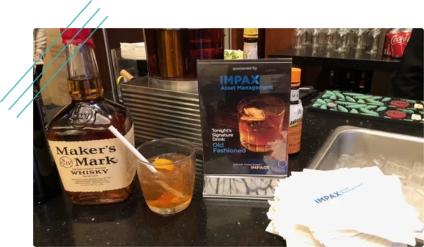 Branded cocktail and bar setup at an event reception