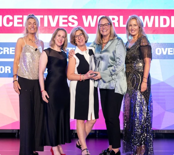 M&IW team members on stage at an awards ceremony