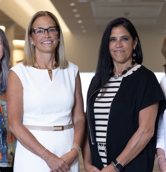 Two M&IW leaders standing together at an event