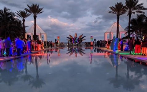 A poolside event at dusk