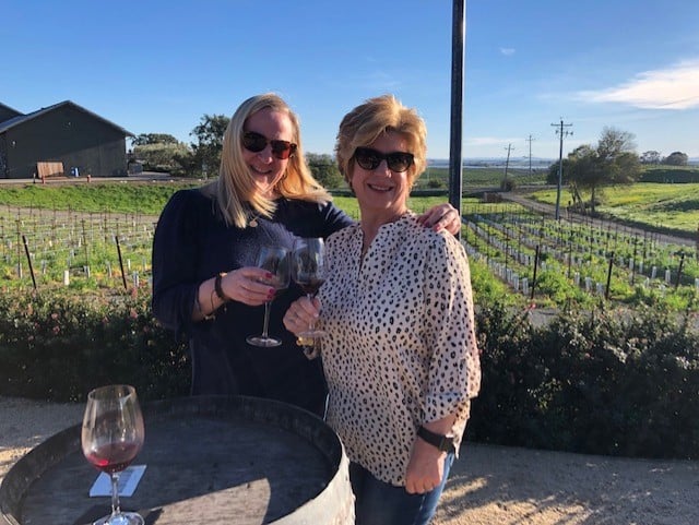 Meg Castro and a colleague at an onsite wine tasting
