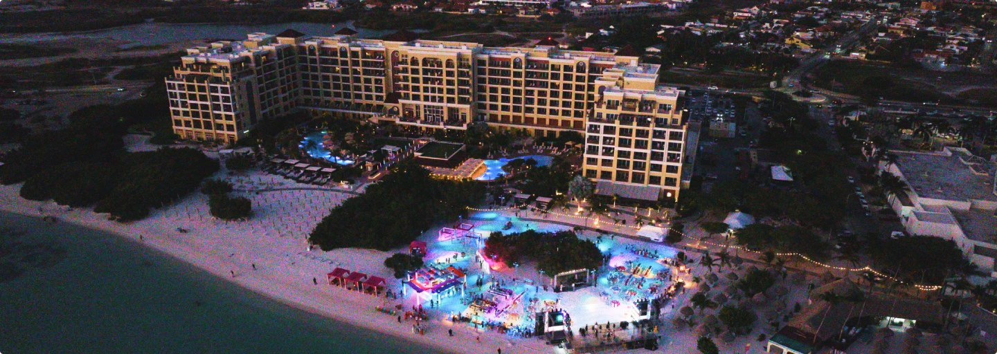 Aerial view of a beachfront resort venue at night