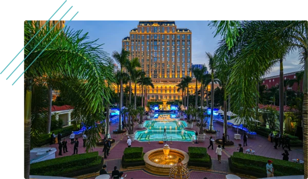 Resort hotel courtyard with fountain and palm trees