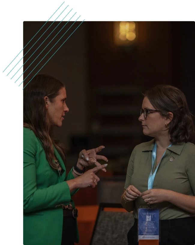 Two attendees talking at a networking event
