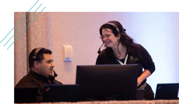 Event technicians with headsets at a production table